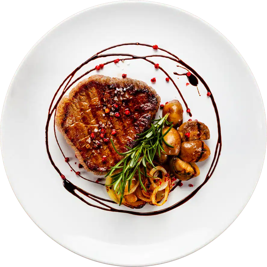 Juicy steak with vegetables and balsamic glaze at Odawa Casino & Resort restaurant.