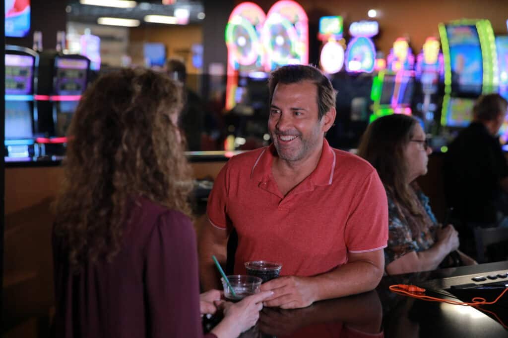 Offers a lively casino atmosphere with friendly staff and vibrant neon gaming machines at Odawa Casino & Resort.