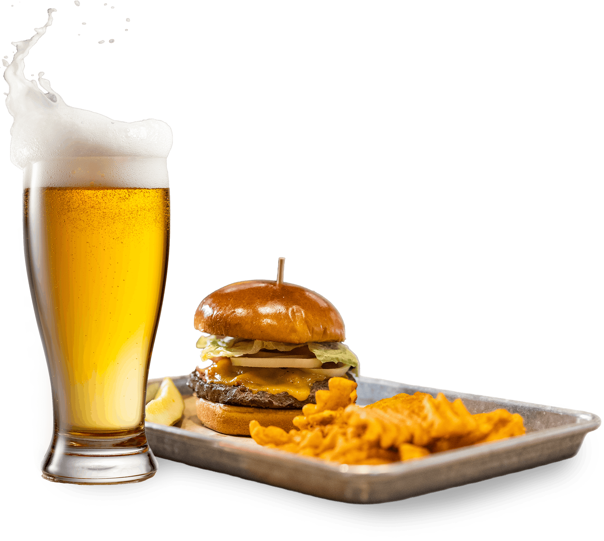 Golden beer in a tall glass with foamy head, alongside a cheeseburger and crispy fries on a tray.