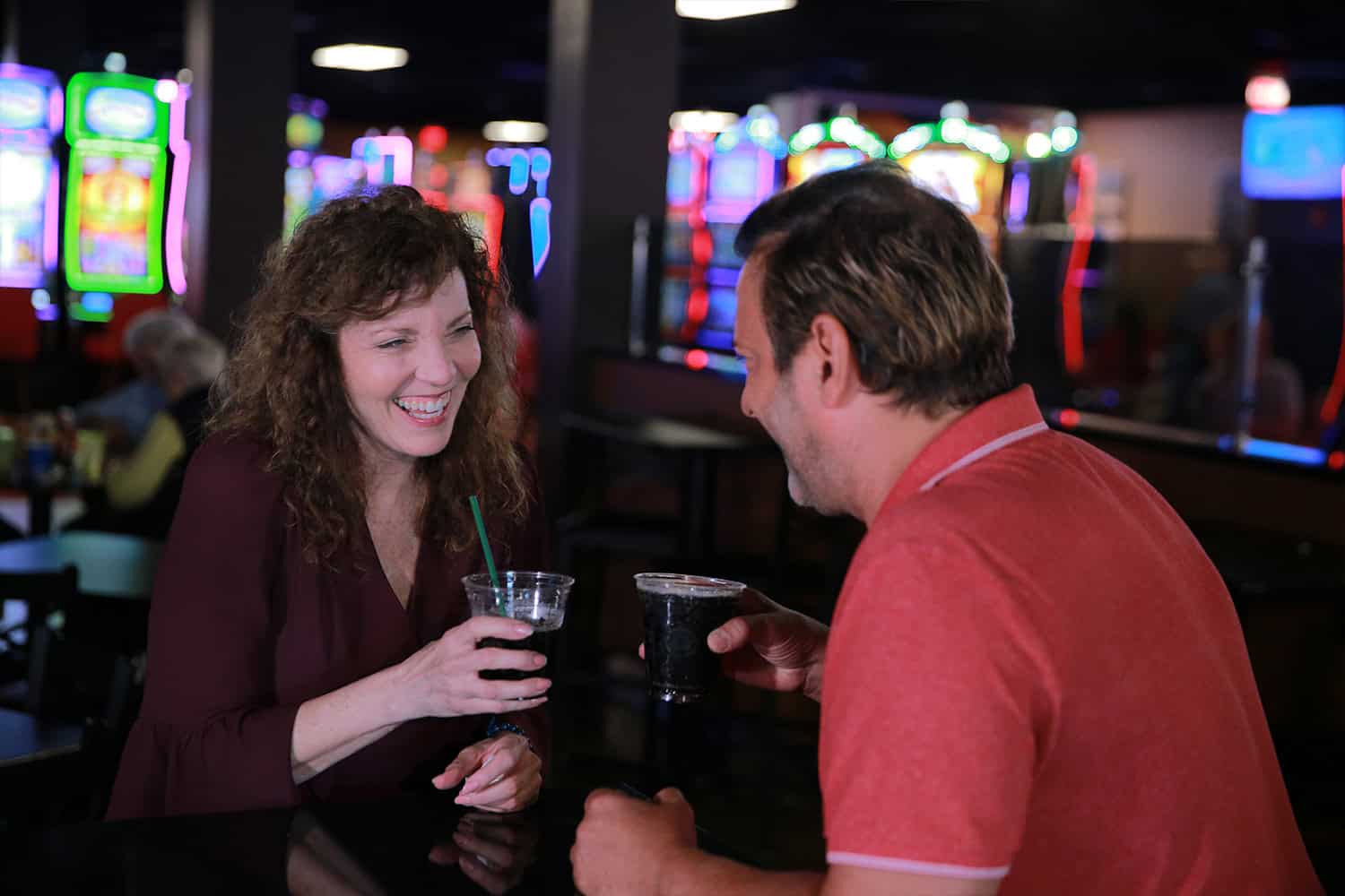 Vibrant Odawa Casino & Resort with people enjoying drinks at the lively bar area.