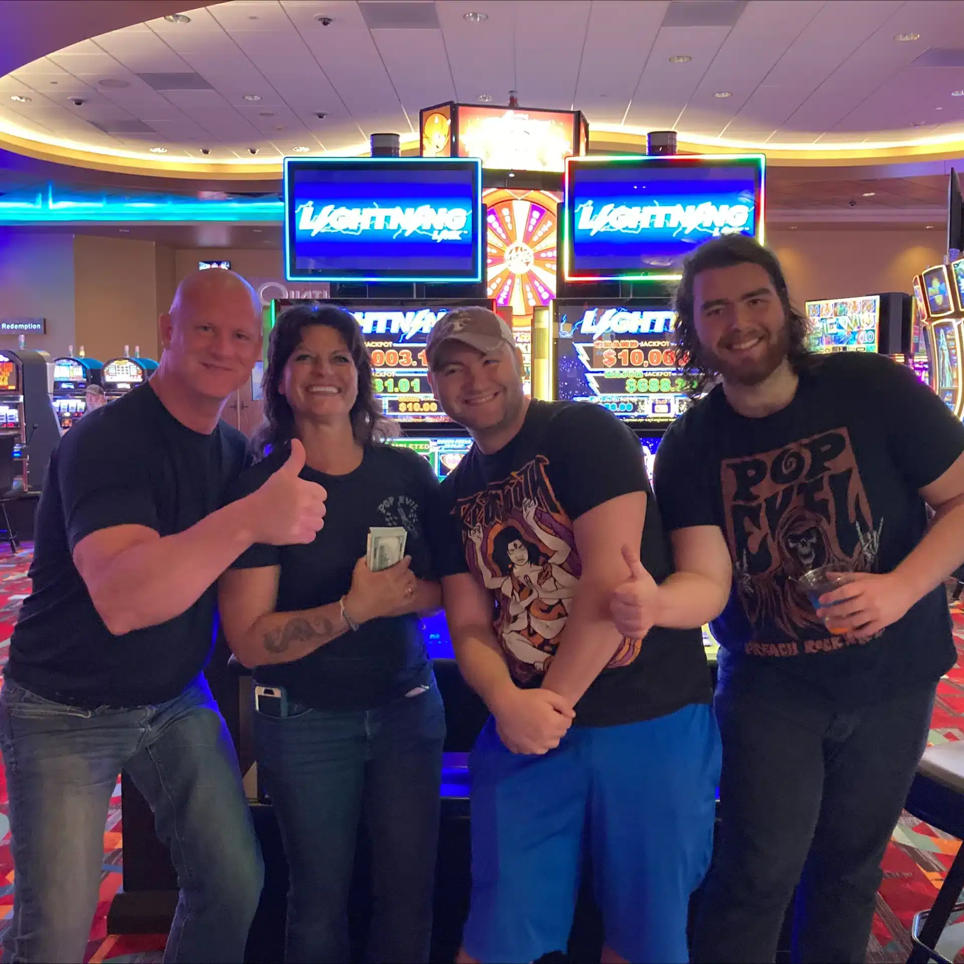 Vibrant casino floor at Odawa Casino & Resort featuring slot machines and lively gaming atmosphere.