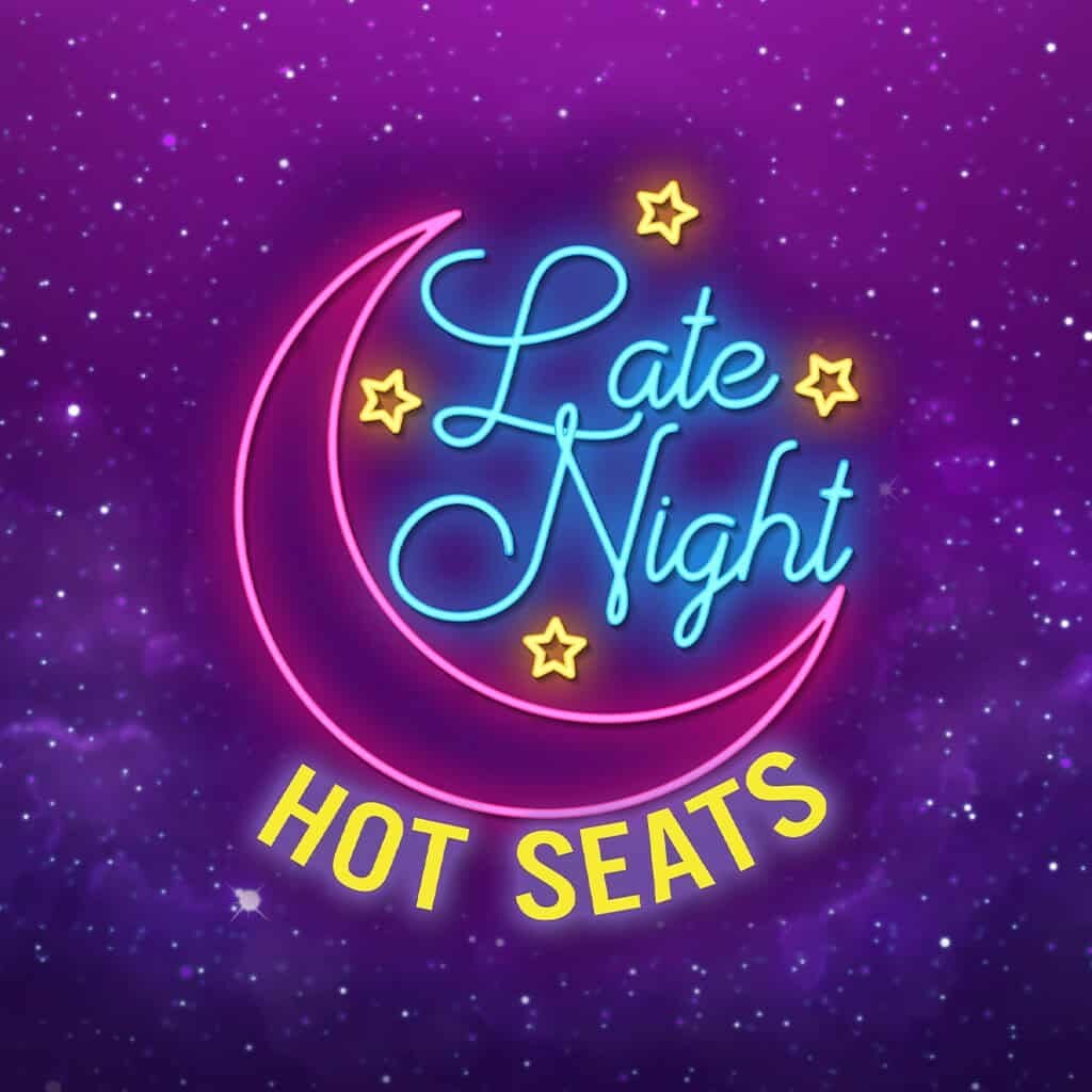 Neon sign reading "Late Night Hot Seats" with stars and crescent moon at Odawa Casino & Resort.