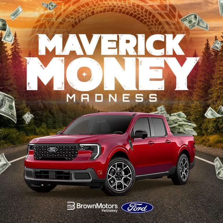 Red Ford Maverick truck on road with dollar bills flying around.