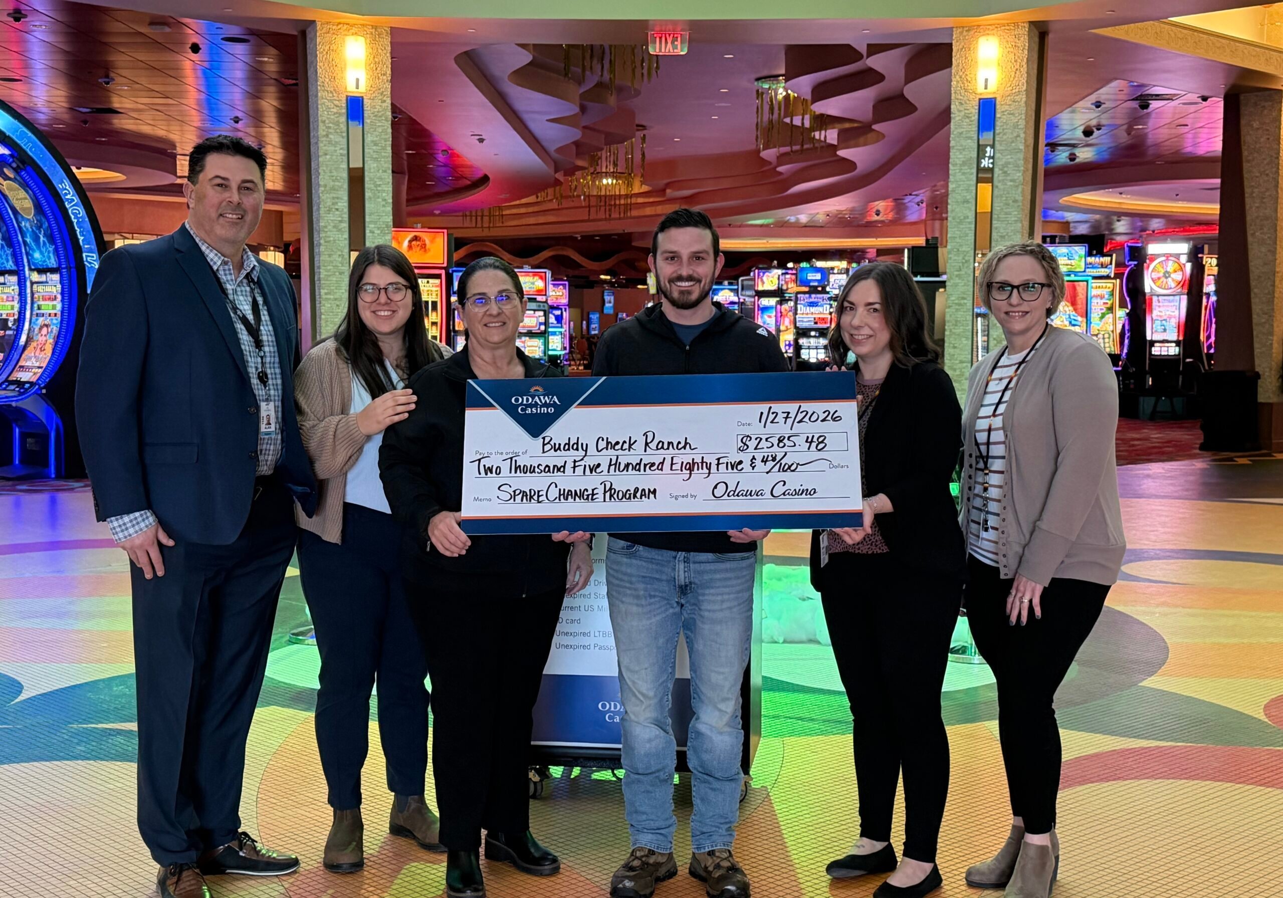 Community members holding a large check at Odawa Casino & Resort.