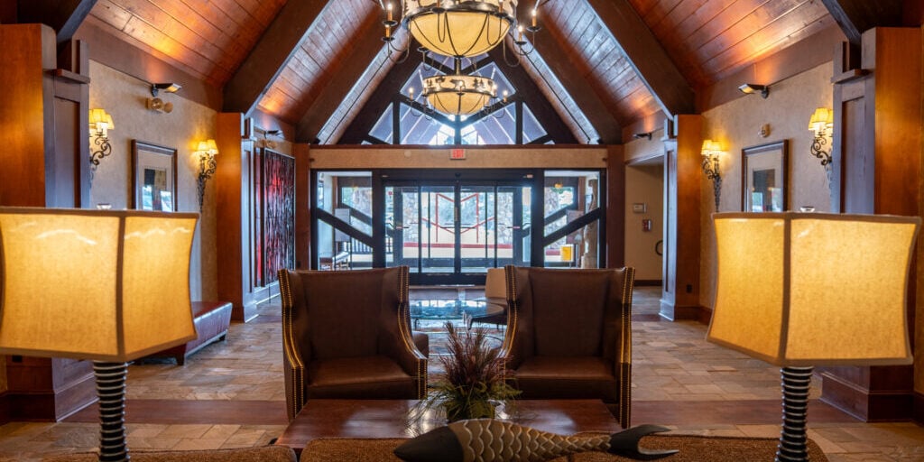 Elegant lodge lobby at Odawa Casino & Resort with wood accents and cozy seating.