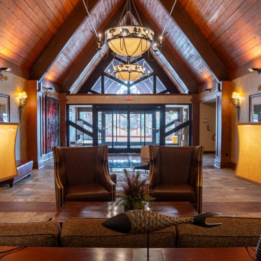 Elegant lodge lobby at Odawa Casino & Resort with wood accents and cozy seating.