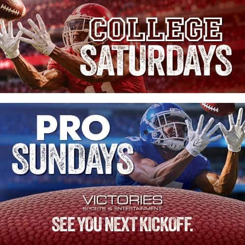 Football players celebrating during game at Victories sports bar.