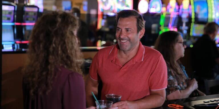 Offers a lively casino atmosphere with friendly staff and vibrant neon gaming machines at Odawa Casino & Resort.