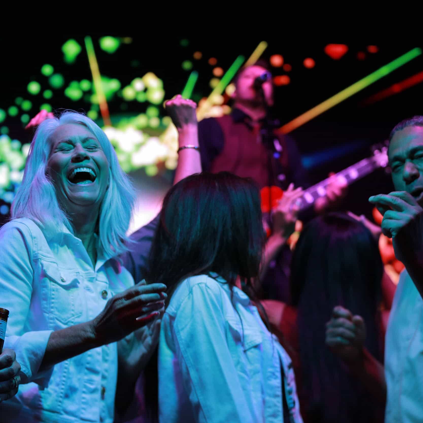 Vibrant casino party scene at Odawa Casino & Resort with lively guests enjoying entertainment and gaming.