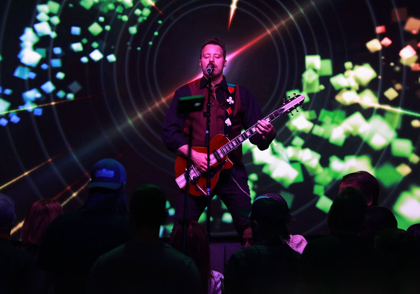 Odawa Casino & Resort live music performance with DJ playing guitar on stage.