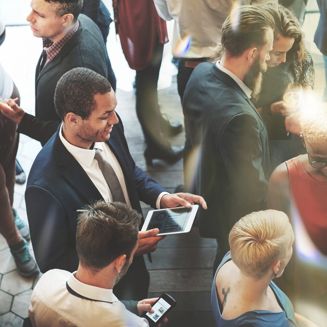 Vibrant casino event with diverse group of people enjoying Odawa Casino & Resort atmosphere.