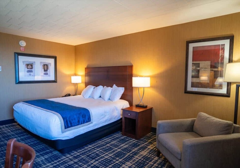 Modern hotel room at Odawa Casino & Resort with comfortable bedding and stylish decor.