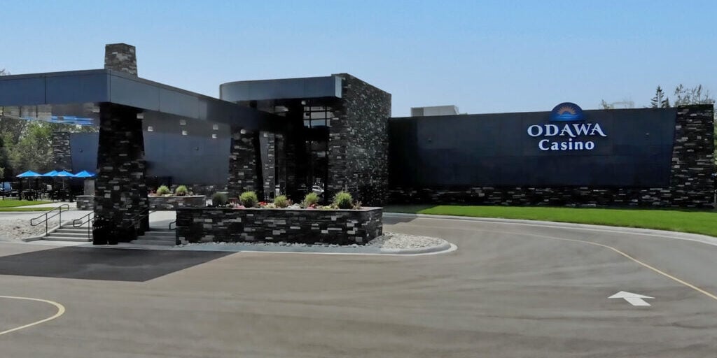 Modern Odawa Casino & Resort exterior with contemporary black stone design and welcoming entrance.