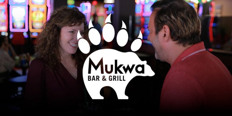 Casino bar and grill at Odawa Casino & Resort, lively atmosphere, people enjoying drinks and gaming.