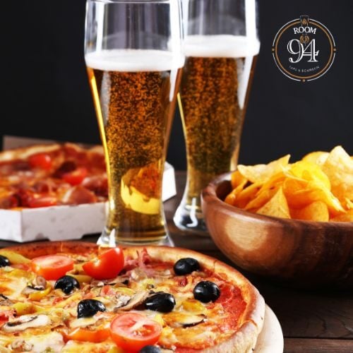 Beer glasses with pizza and chips at Odawa Casino & Resort, Michigan.