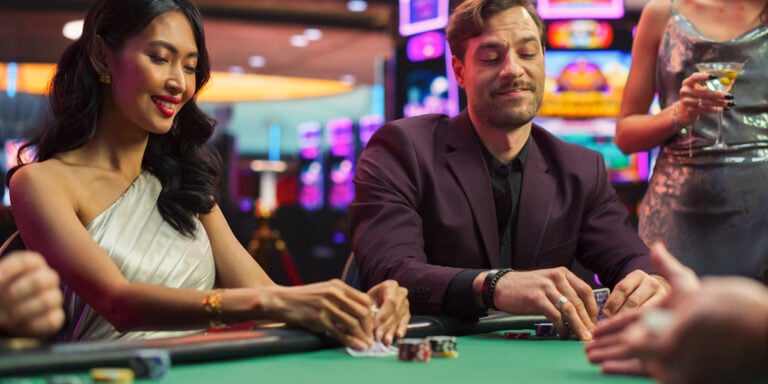 Exciting casino gaming at Odawa Casino & Resort with players enjoying poker and table games.