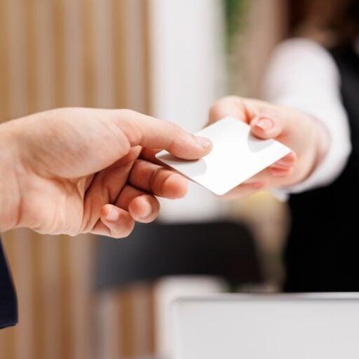 Handing over a rewards card at Odawa Casino & Resort casino reception in Michigan.