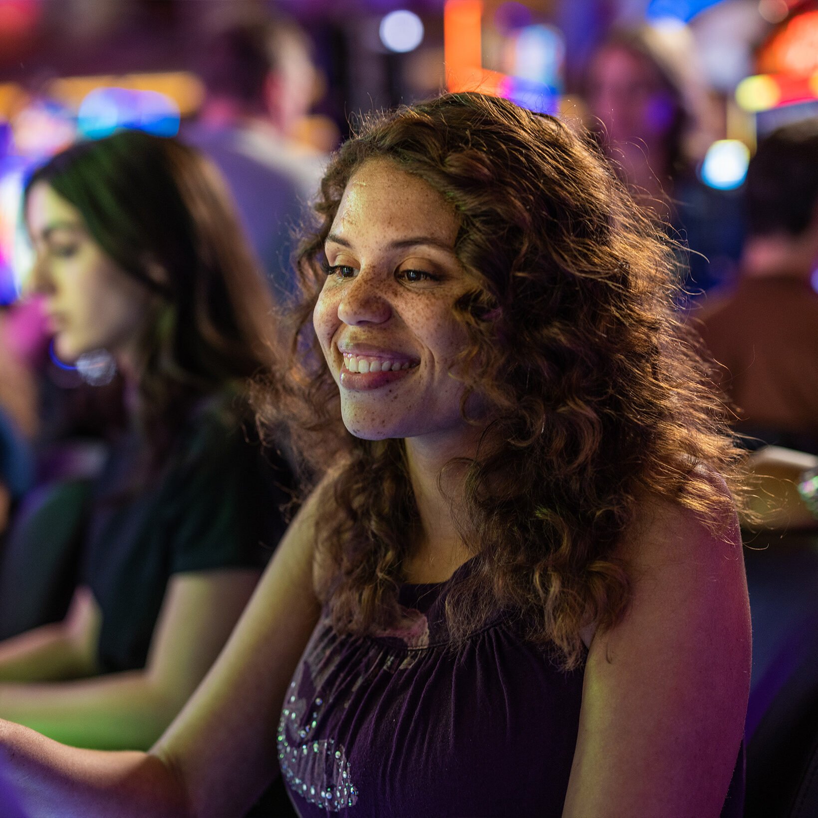 Colorful casino gaming floor at Odawa Casino & Resort with guests enjoying their visit.