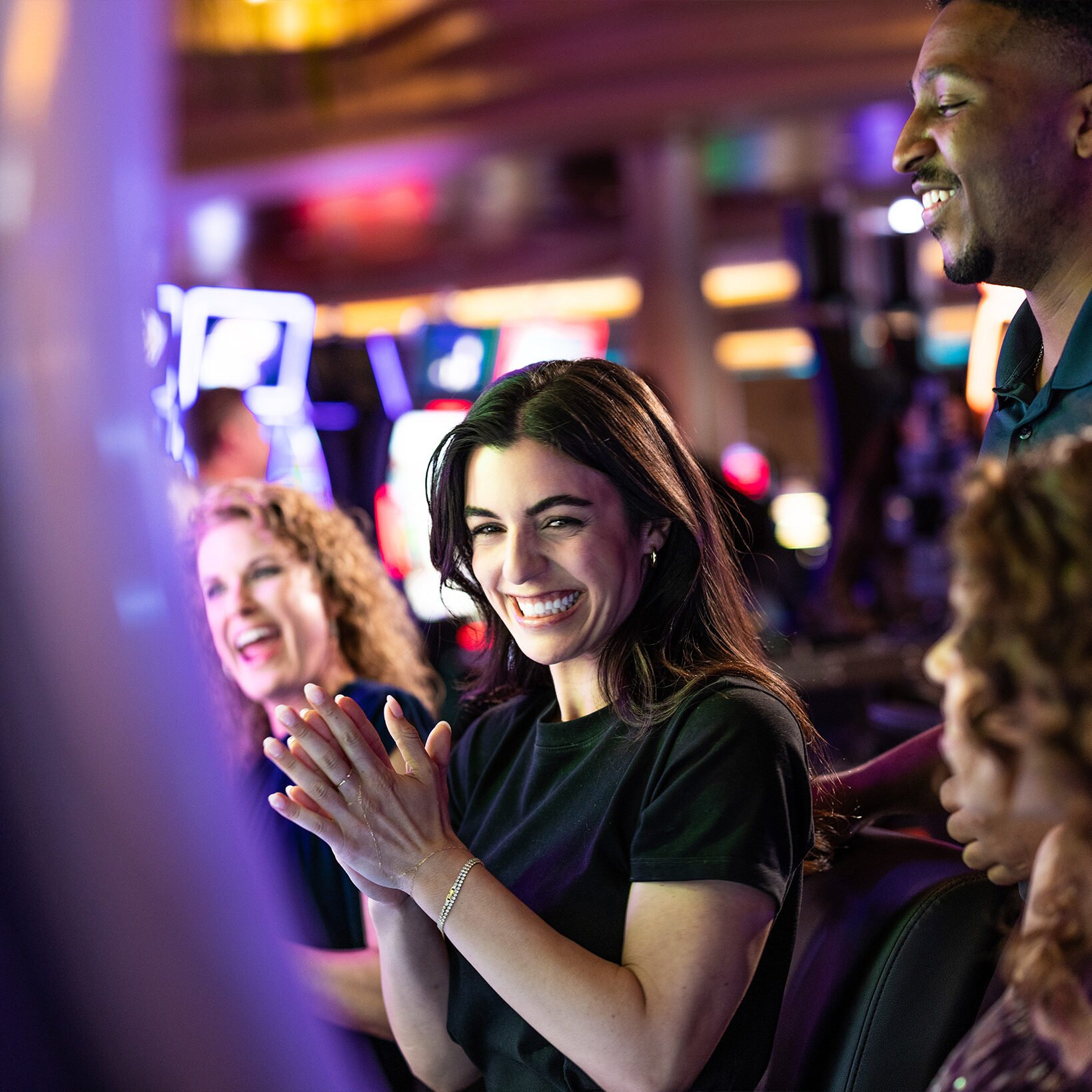 Exciting casino gaming at Odawa Casino & Resort with happy players and lively atmosphere.